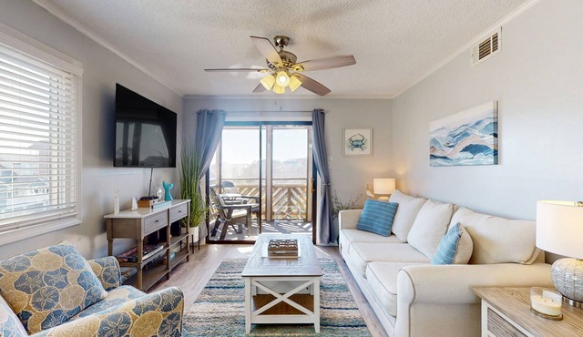 Ocean-view condo, 1 block from beach with enclosed balcony & pool