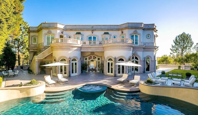 This house is a 8 bedroom(s), 9 bathrooms, located in Beverly Hills, CA.